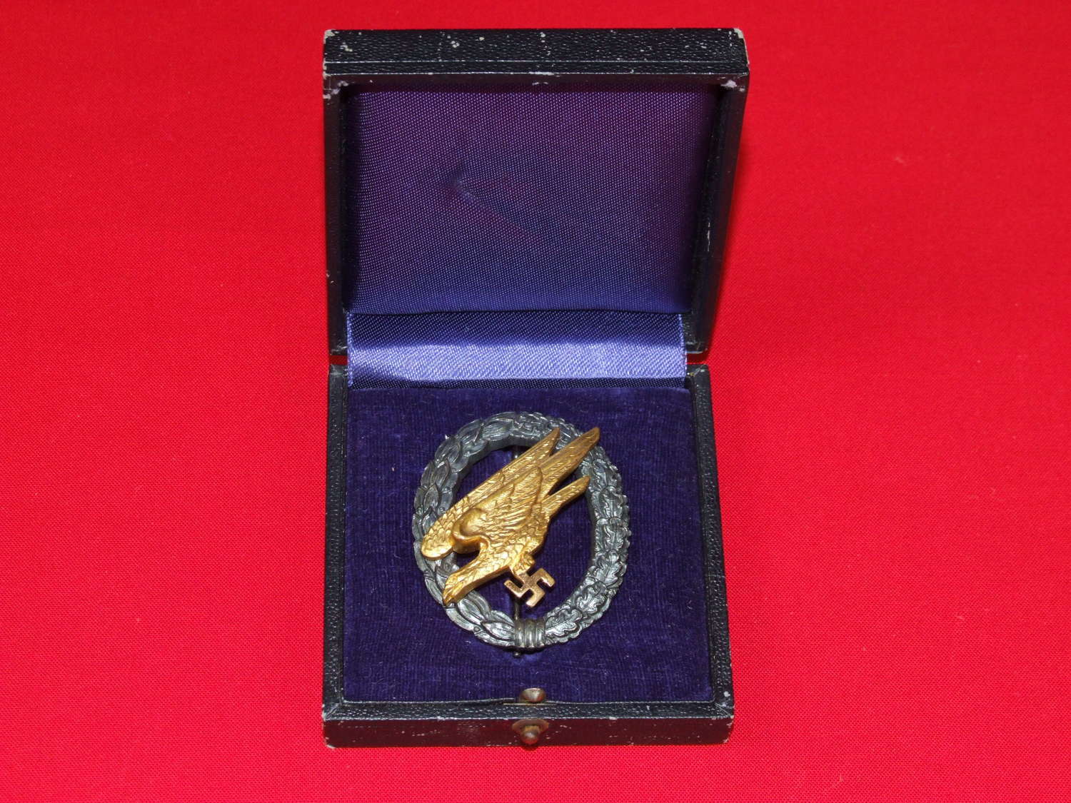 A Cased Tombac Fallschirmjäger Badge, by Wilhelm Deumer