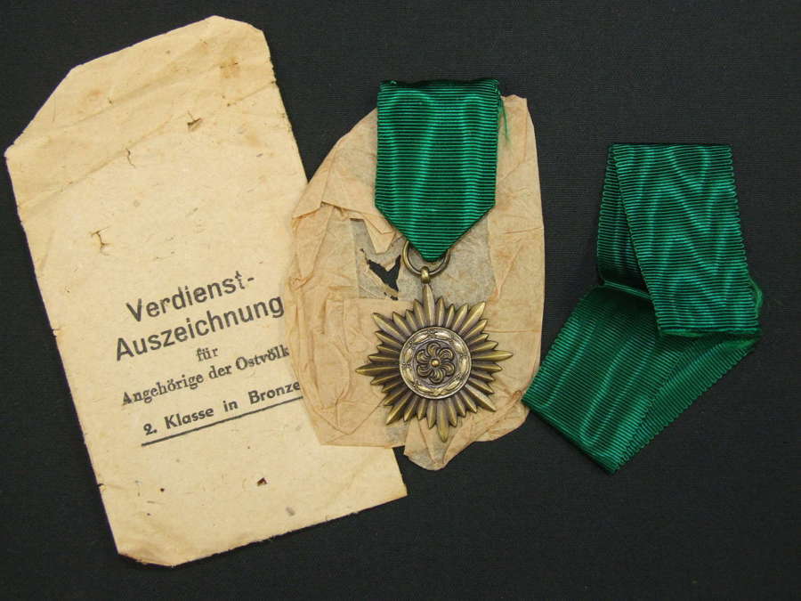 A Bronze Grade Ostvolk Merit Medal in its Original Packet of Issue
