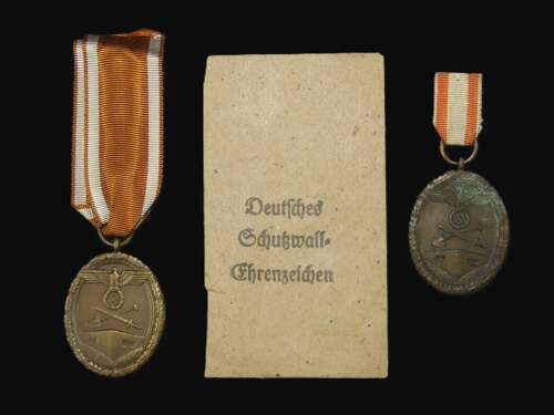 2 x Westwall Medals with an Original Packet of Issue by Carl Poellath.